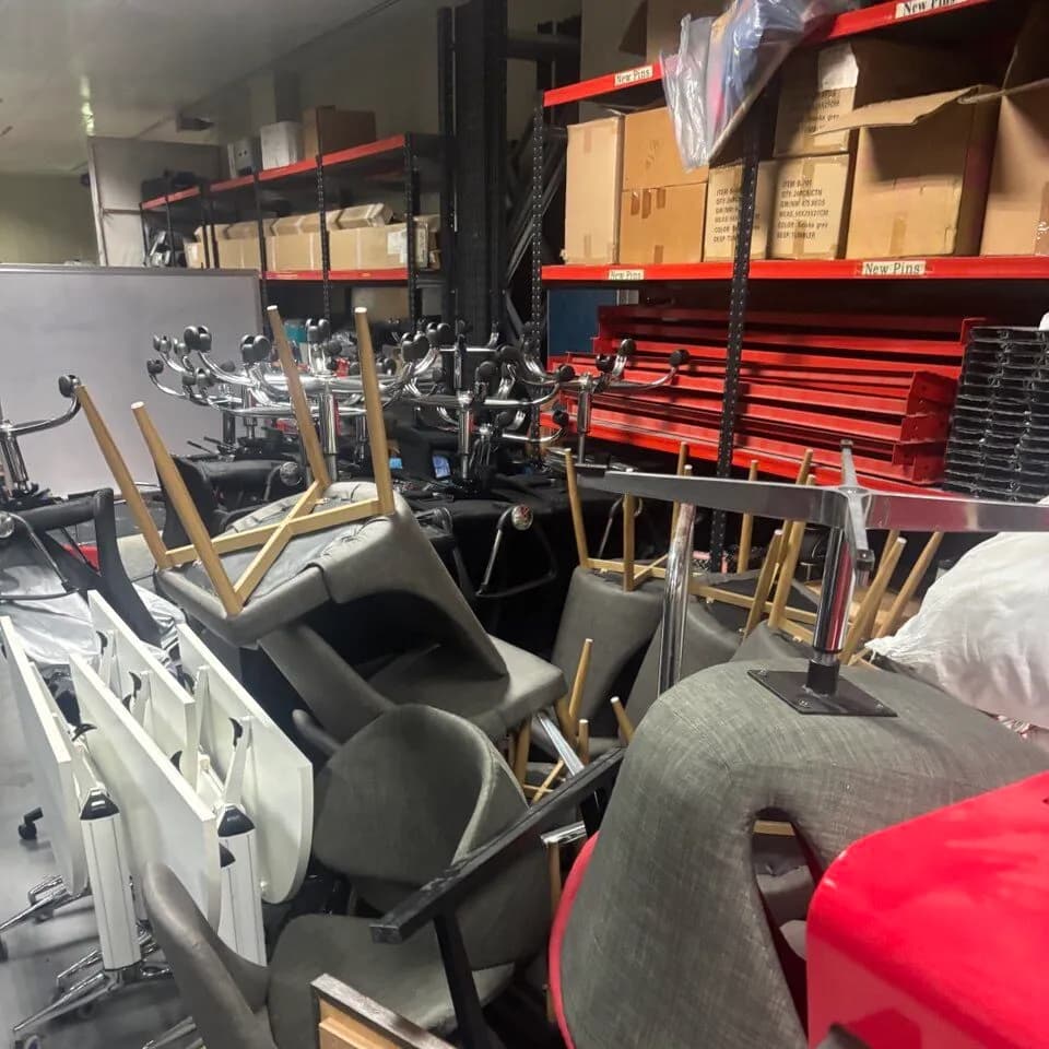 Pre-loved office chairs and tables collected for refurbishment and resale