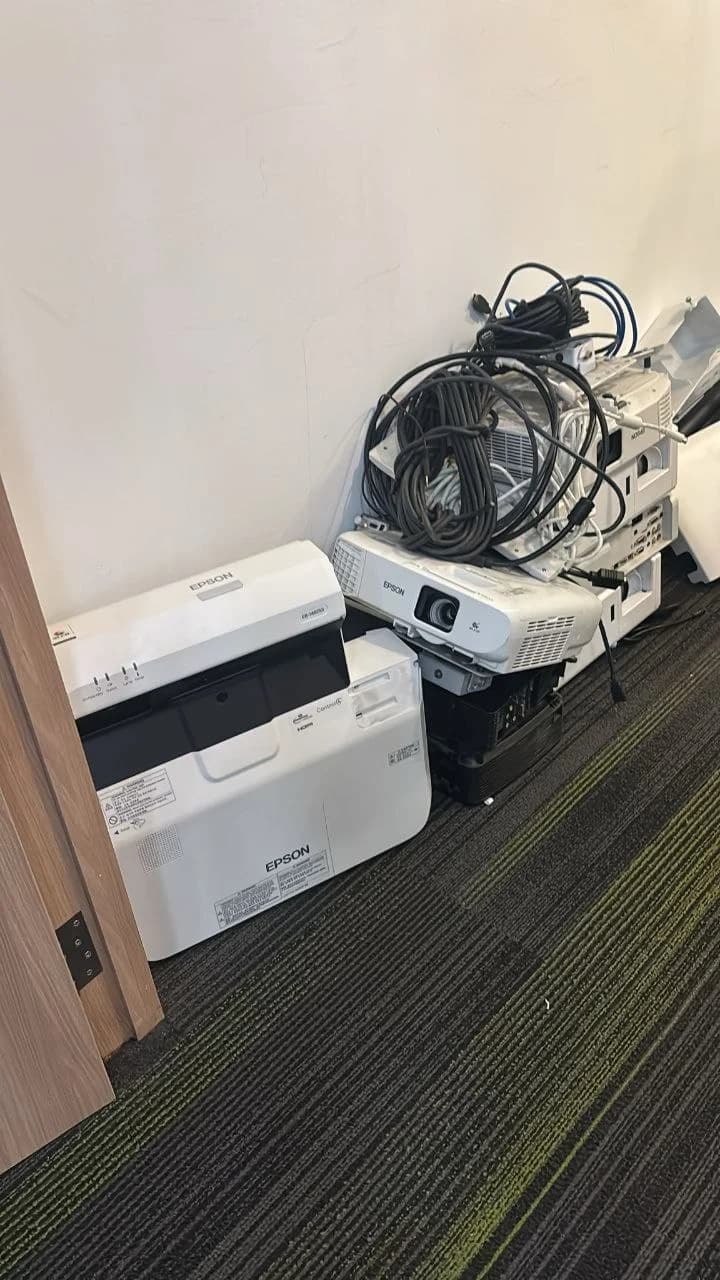 Used office projectors and cables collected for electronics buyback